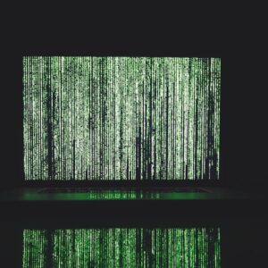Abstract depiction of green matrix code on a computer monitor.