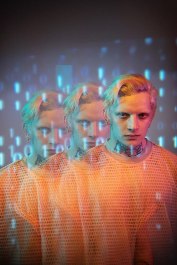 Innovative portrait of a person with blonde hair and binary code overlay. Digital art effect with triple exposure.